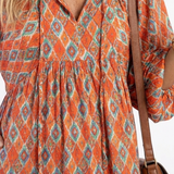 Amara | Geometric Print V Neck Tiered Midi Dress